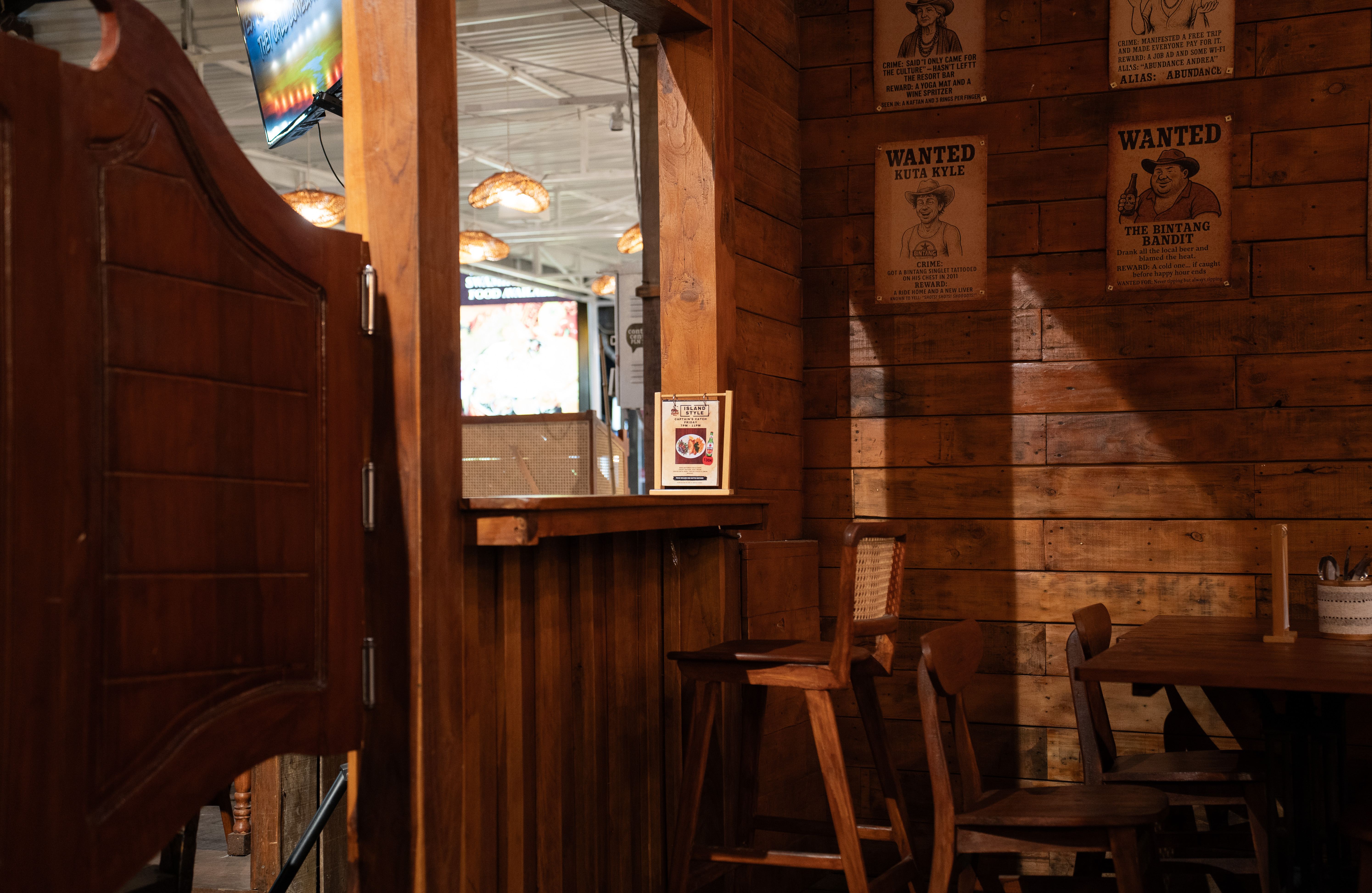 Rustic dining area with saloon doors and western decor